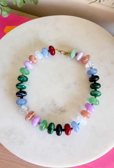 Brighten every outfit with this beautifully handcrafted beaded necklace! Designed with stunning marble beads in blush, lavender, mint, sky blue, emerald, and berry, this colorful accessory brings a playful yet elevated touch to your everyday style. Each handcrafted bead gives the necklace its own unique character, making it a one-of-a-kind piece you'll love wearing season after season. Whether layered with your favorite chain or worn on its own, it's the perfect finishing touch for any look.