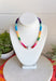 This colorful gemstone beaded necklace is pure happiness in accessory form! Featuring a mix of purple, blue, orange, yellow, green, and pink with a pearl accent, it adds the perfect playful pop to all your summer outfits. It’s bright, fun, and instantly makes even the simplest look feel styled. The shorter length sits perfectly at the neckline, making it great for layering or wearing solo as a statement.