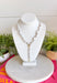 Classic pearls meet modern elegance in this stunning lariat necklace! Featuring lustrous pearls and a chic gold toggle closure, this timeless piece is finished with a sparkling rhinestone accent that adds just the right amount of shimmer. Whether you're dressing up for a holiday celebration, wedding, date night, or simply elevating your everyday style, this handcrafted necklace brings effortless sophistication to any outfit.