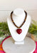 Rich natural tones and meaningful details make this handcrafted necklace a piece you'll treasure for years to come! Featuring genuine tiger eye natural stone beads, this beautiful necklace is finished with a striking burgundy heart pendant that adds the perfect pop of color. Whether worn alone or layered with your favorite chain, this timeless accessory effortlessly elevates everything from cozy sweaters to feminine dresses.