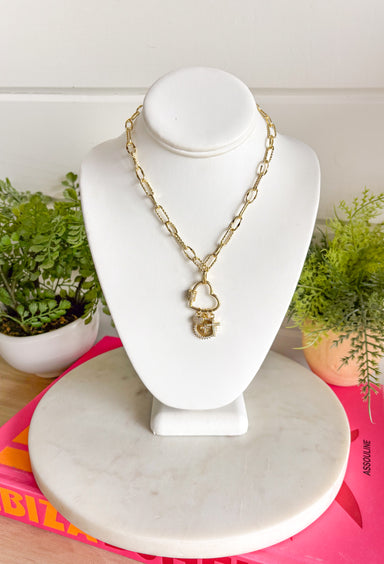 Meaningful, delicate, and full of sparkle! This 14k gold plated necklace features a beautiful mix of pavé crystal cross charms paired with a sweet mini heart charm that hangs from a gold open heart pendant. The combination of faith-inspired details and subtle shimmer creates a piece that feels both special and easy to wear. Set on a classic gold chain, this necklace layers beautifully with other favorites or stands out perfectly on its own. 