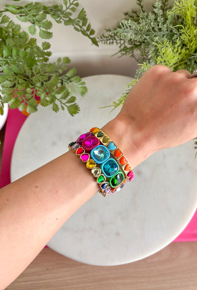 All the color, all the hearts, all the sparkle! This playful bracelet set is made to brighten your look with a vibrant mix of glossy heart tiles and oversized multi-color gemstone accents framed in warm gold tone settings. Each bracelet brings its own pop of color and shine, creating a fun, cheerful stack that instantly makes a statement.&nbsp;Designed to layer beautifully together, these bracelets create a bold, happy look when worn as a full stack. You can also mix and match them with your other favorites