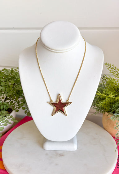 Add a little sparkle to every outfit with this stunning star pendant necklace! Featuring a bold gold star framed by delicate crystal accents, this handcrafted piece is the perfect blend of timeless elegance and modern charm. Whether you're dressing up for a special occasion or adding a little shine to your everyday look, this eye-catching necklace is designed to stand out while remaining effortlessly wearable.