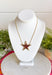 Add a little sparkle to every outfit with this stunning star pendant necklace! Featuring a bold gold star framed by delicate crystal accents, this handcrafted piece is the perfect blend of timeless elegance and modern charm. Whether you're dressing up for a special occasion or adding a little shine to your everyday look, this eye-catching necklace is designed to stand out while remaining effortlessly wearable.