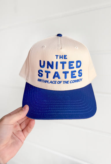 Friday + Saturday: Birthplace Of The Cowboy Trucker Hat in Blue, Royal Blue and Cream baseball styled trucker hat with "the united states birthplace of the cowboy" embroidered in royal blue 