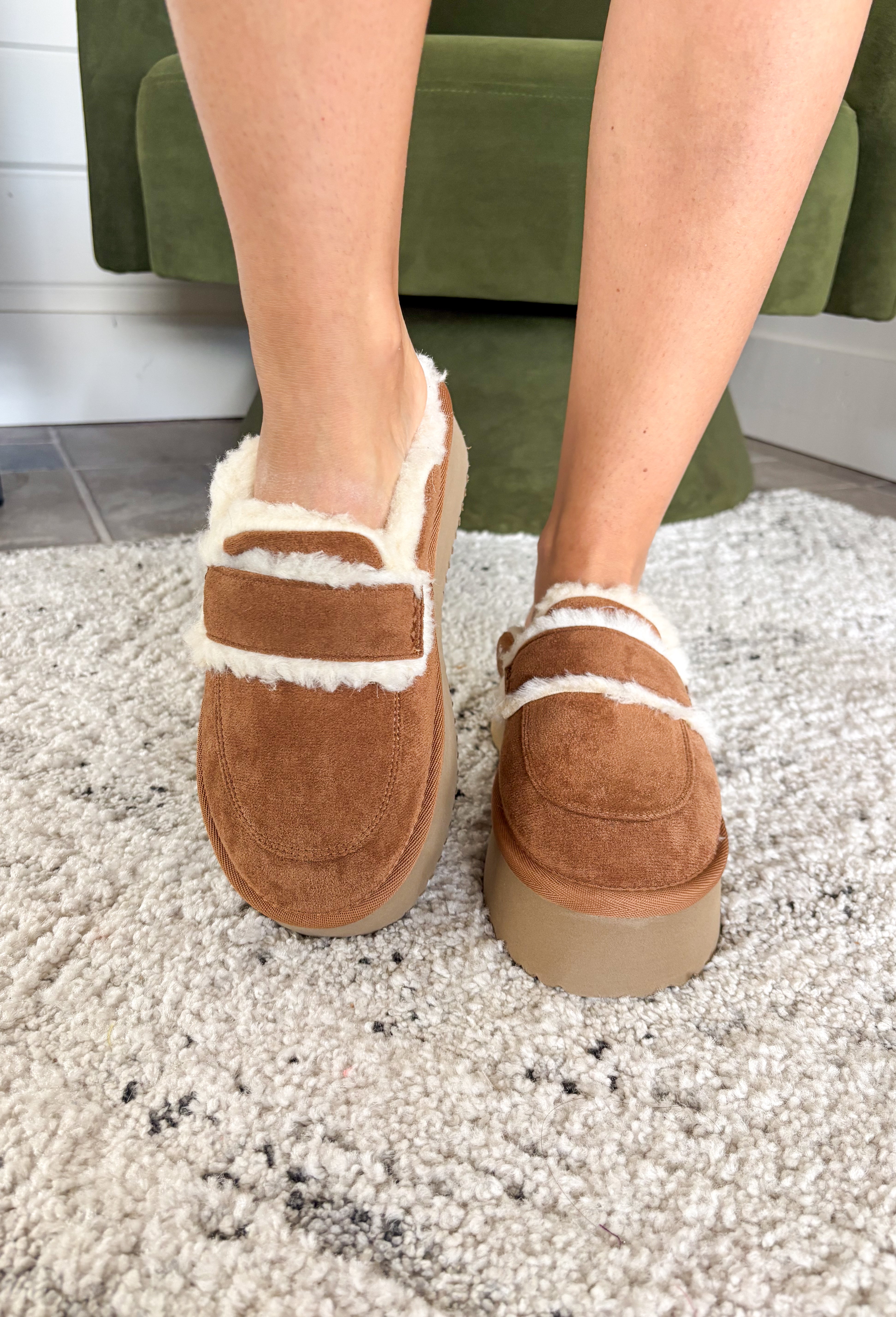 The Veg Out Platform Mule by Hey Girl by Corkys is where everyday comfort meets laid-back style. Crafted with a soft camel suede upper and lined in plush faux shearling, this slip-on mule is as cozy as it is trendy. The round toe keeps it casual, while the platform sole adds a retro-inspired edge—perfect for styling with everything from denim to loungewear. Designed for all-day wear, it’s the ultimate cozy-chic shoe to take you through the season.