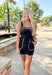 Cruel Summer Romper, black sleeveless romper with tan stitched edges on the chest, pockets, and bottom hem