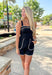 Cruel Summer Romper, black sleeveless romper with tan stitched edges on the chest, pockets, and bottom hem