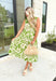 French Riviera Midi Dress, sleeveless midi dress in a lime green with creamy floral pattern, ruffling around the neck, v-neck, tiering 