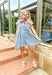 Heading West Denim Dress, acid washed denim babydoll button down dress with four little pleats on each front half of the dress and two front pockets with button closures 