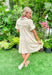 Hope You Know Dress in Natural, gauze cream short sleeve v-neck dress with a collar, textured polkadots all over the dress, tiering, raw bottom hem, cinching at the bottom of the sleeves