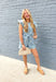 Keep Them Talking Denim Romper, ruffle sleeve button down denim romper with pockets and tie details at the waist 