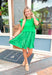 Love The Game Dress, kelly green layered dress, top half is a sweatshirt material with flutter sleeves and a heart stitched on the back, bottom half is a lighter weight pleated material 