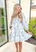Make It A Date Dress, long sleeve blue and white abstract shape tiered dress with v-neck and pockets 