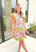 Springtime Chic Floral Dress, light pink, bubble gum pink, yellow, orange, and light blue tulip printed dress, rikrak on the two tiers of the dress as well as the ruffle sleeves in the color yellow and green