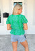 Thinking Out Loud Top, kelly green puff sleeve blouse with v-neck, light blue eyelet lace detailing on the whole blouse