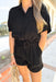 Z SUPPLY Lookout Gauze Romper, black gauze short sleeve button down romper with drawstring around the waist, rolled sleeves, front pockets on the chest and pockets at the waist