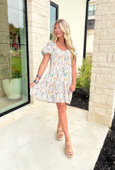 In The Hamptons Dress, Mini dress with a colorful abstract print, Features elastic sleeve band and a tie back