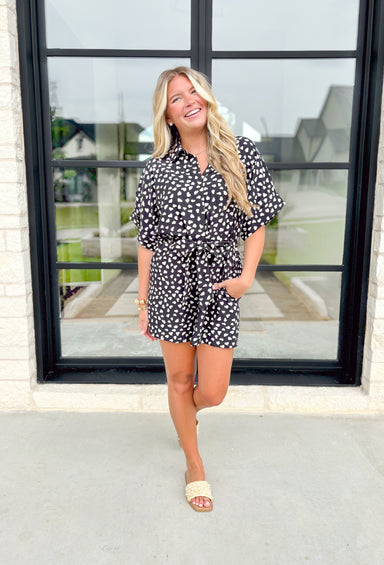 With Love Romper, black romper with white dots, button down with collar and tie detail around the waist