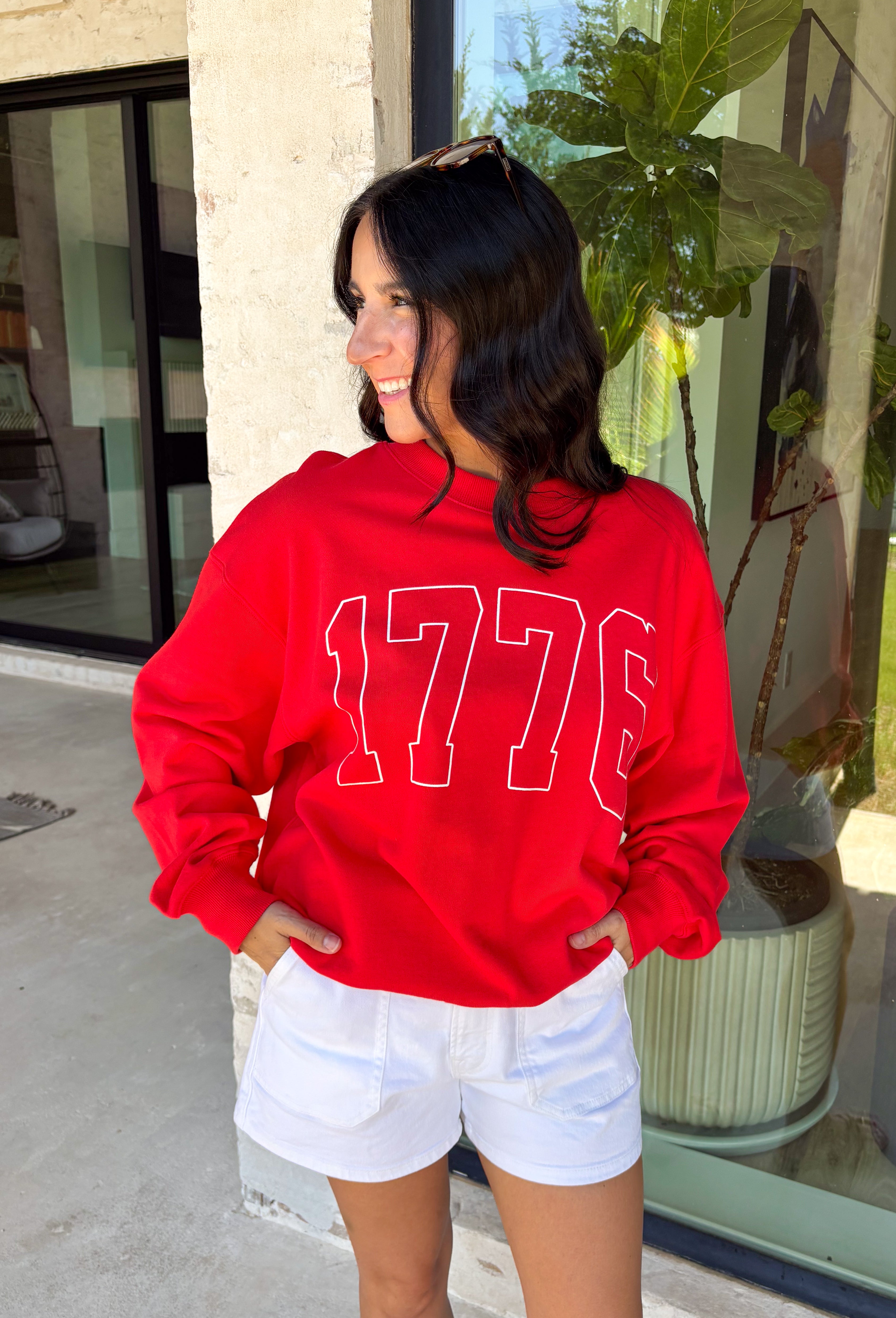 A timeless nod to American pride! This red pullover features “1776” in bold white lettering across the front, making it the perfect piece to celebrate Independence Day and beyond. Classic, patriotic, and easy to style, it’s a go-to for summer holidays, fireworks, and casual days. Made from soft 100% cotton, this pullover is comfortable and breathable while still giving you that cozy feel. 