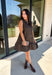Leopard gets a refined update with this black and brown printed dress from Entro. The neutral color palette gives the statement print a classic feel, making it easy to wear for everything from dinner plans and work events to fall gatherings. A full button-down detail off centered adds an unexpected touch that sets this dress apart, while the sleeveless silhouette keeps the look clean and easy to layer. The tiered skirt adds movement and shape, and the fully lined design provides comfortable coverage.