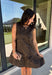 Leopard gets a refined update with this black and brown printed dress from Entro. The neutral color palette gives the statement print a classic feel, making it easy to wear for everything from dinner plans and work events to fall gatherings. A full button-down detail off centered adds an unexpected touch that sets this dress apart, while the sleeveless silhouette keeps the look clean and easy to layer. The tiered skirt adds movement and shape, and the fully lined design provides comfortable coverage.