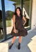 Leopard gets a refined update with this black and brown printed dress from Entro. The neutral color palette gives the statement print a classic feel, making it easy to wear for everything from dinner plans and work events to fall gatherings. A full button-down detail off centered adds an unexpected touch that sets this dress apart, while the sleeveless silhouette keeps the look clean and easy to layer. The tiered skirt adds movement and shape, and the fully lined design provides comfortable coverage.