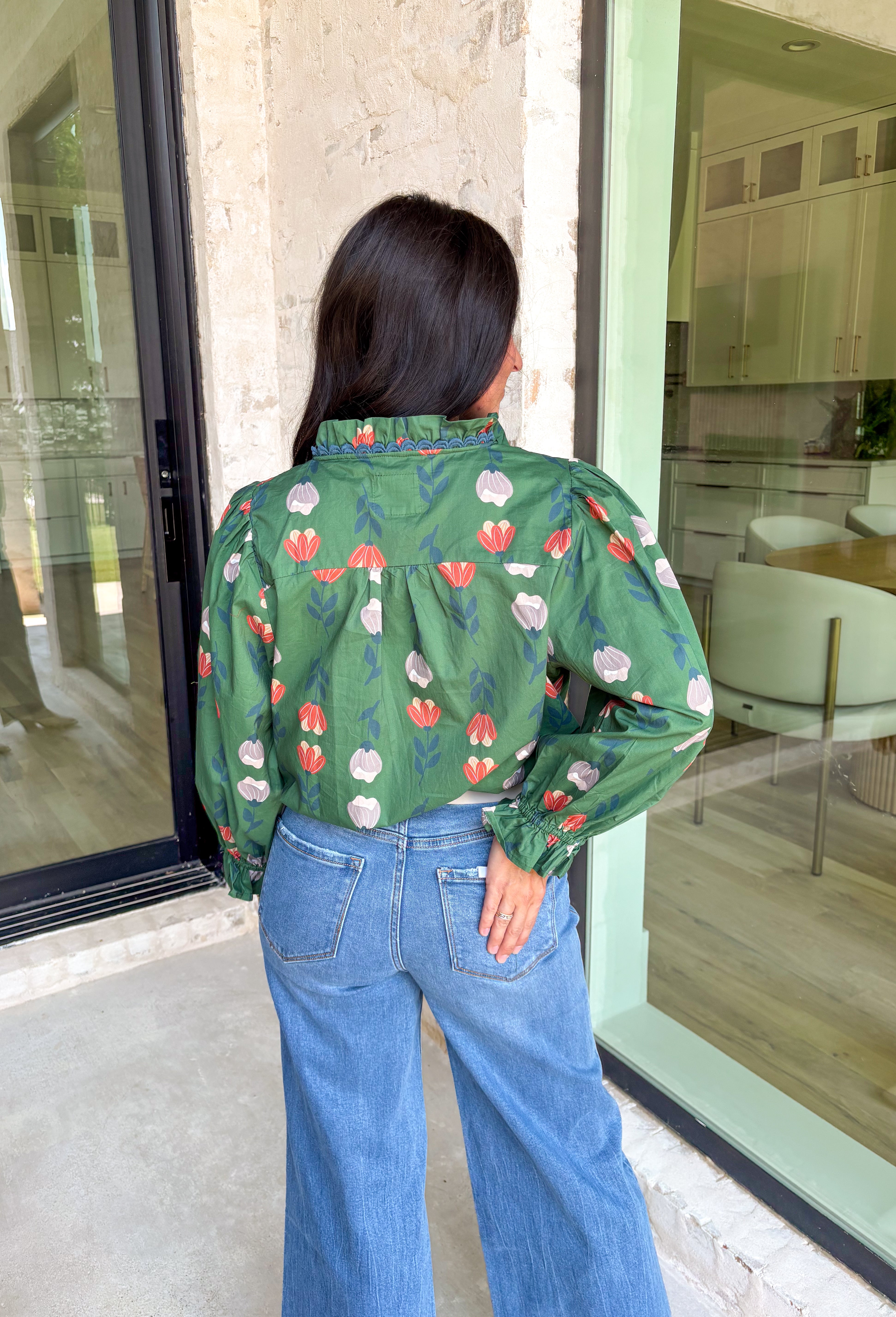 Romantic florals with delicate details—this green button-down top is a fall must-have. The all over floral print in shades of charcoal, rust, and cream feels warm and seasonal, while smocked sleeves and a ruffle neckline add a soft, feminine touch. Scalloped trim frames the neckline for a sweet finishing detail, making this lightweight cotton blouse an easy choice for workdays, weekends, or cozy outings.