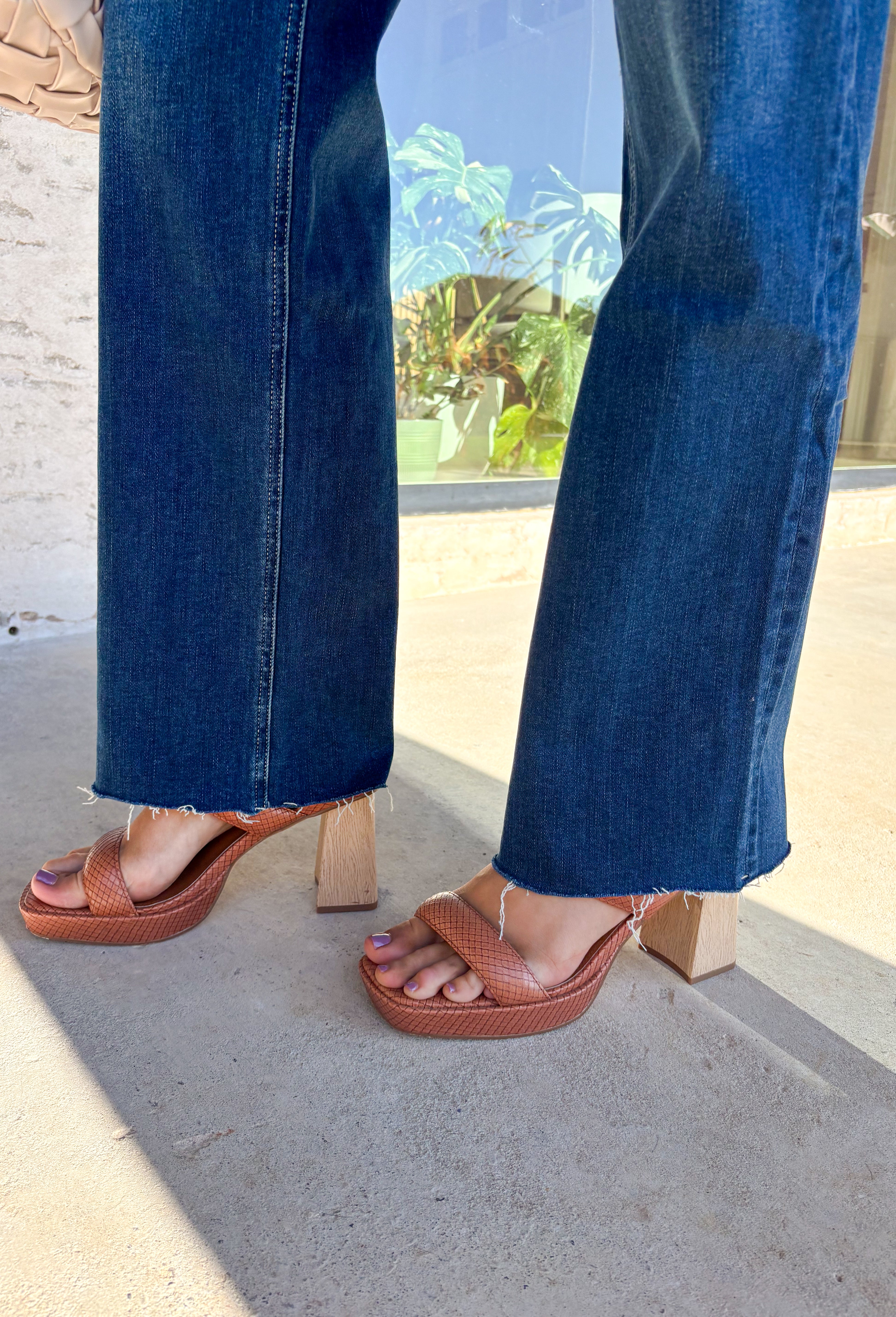 Sleek meets laid-back in these dark wash slim wide jeans from Vervet. The flattering high-rise fit and straight-but-wide leg shape make them an easy choice for pairing with everything from cozy sweaters to tailored blouses. The raw edge hem adds a touch of casual edge, perfect for dressing up or down. With a soft cotton blend and a hint of stretch, they’re comfortable enough for all-day wear while still holding their shape—your new go-to denim for the season.