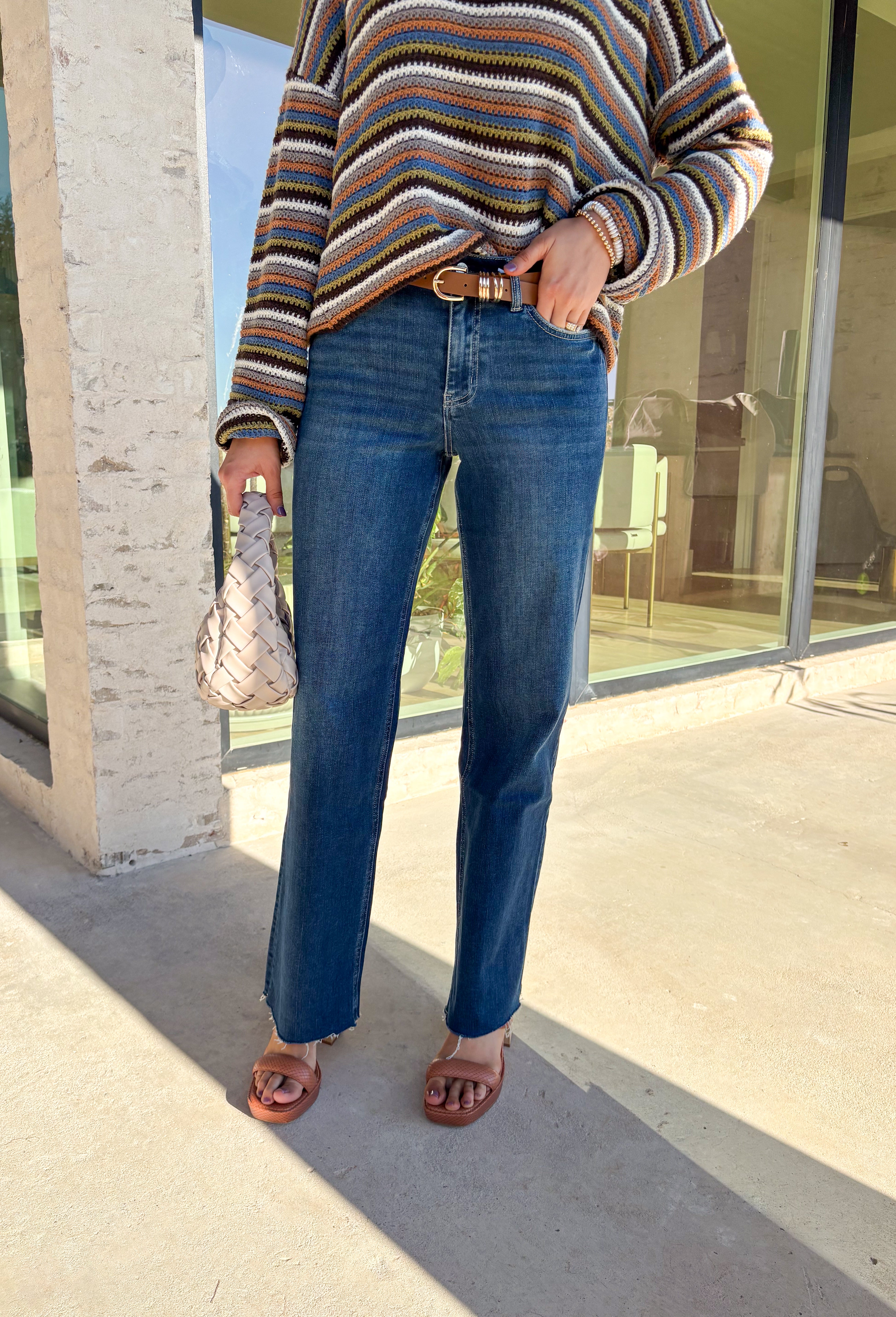 Sleek meets laid-back in these dark wash slim wide jeans from Vervet. The flattering high-rise fit and straight-but-wide leg shape make them an easy choice for pairing with everything from cozy sweaters to tailored blouses. The raw edge hem adds a touch of casual edge, perfect for dressing up or down. With a soft cotton blend and a hint of stretch, they’re comfortable enough for all-day wear while still holding their shape—your new go-to denim for the season.