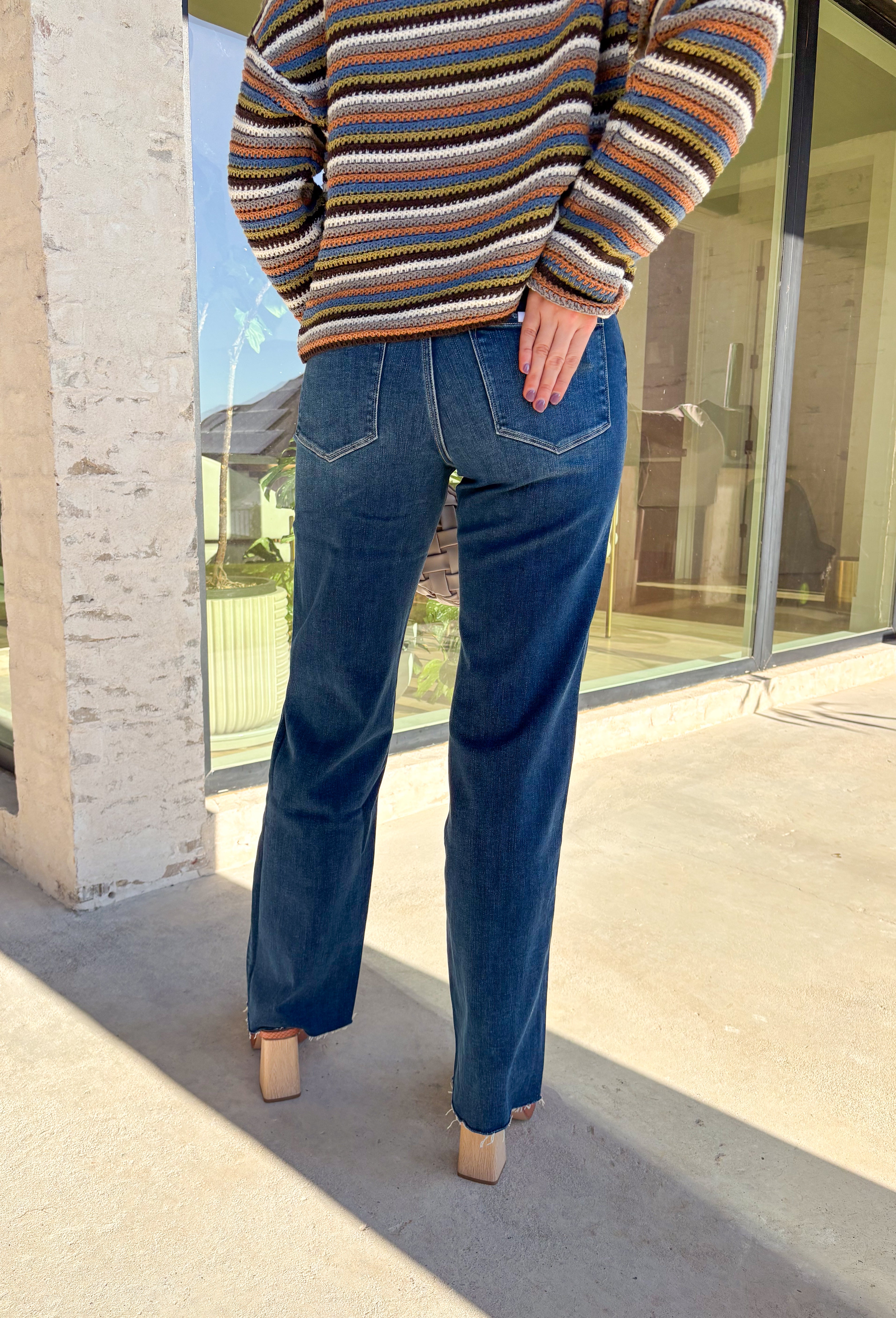 Sleek meets laid-back in these dark wash slim wide jeans from Vervet. The flattering high-rise fit and straight-but-wide leg shape make them an easy choice for pairing with everything from cozy sweaters to tailored blouses. The raw edge hem adds a touch of casual edge, perfect for dressing up or down. With a soft cotton blend and a hint of stretch, they’re comfortable enough for all-day wear while still holding their shape—your new go-to denim for the season.