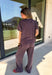 Easy days call for a matching set that looks put together without sacrificing comfort. This two-piece set from Twentifourth features a short sleeve tee and coordinating wide leg pants in a rich mix of merlot, navy, and off white stripes. The soft cotton-blend fabric has a touch of stretch for comfortable all-day wear, while the elastic waistband keeps the pants relaxed and easy. 