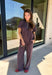 Easy days call for a matching set that looks put together without sacrificing comfort. This two-piece set from Twentifourth features a short sleeve tee and coordinating wide leg pants in a rich mix of merlot, navy, and off white stripes. The soft cotton-blend fabric has a touch of stretch for comfortable all-day wear, while the elastic waistband keeps the pants relaxed and easy. 