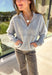 Stay warm and stylish in this heather grey quarter zip pullover by Iris. Designed with a soft fleece lining, it’s as cozy as it looks. The quarter zip neckline adds versatility, while the two front pockets make it practical for everyday wear. With just the right amount of stretch in the fabric, this pullover is perfect for lounging, layering, or running errands in comfort.&nbsp;