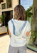Casual, comfy, and just a little elevated! This textured white short sleeve hoodie features soft washed blue detailing along the front, sleeves, and trim for a laid-back, lived-in look. It’s the perfect mix of cozy and lightweight, making it easy to wear year-round. Designed with front pockets for added functionality and a relaxed silhouette, this hoodie is ideal for running errands, lounging, or throwing on for an easy everyday outfit. 