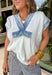 Casual, comfy, and just a little elevated! This textured white short sleeve hoodie features soft washed blue detailing along the front, sleeves, and trim for a laid-back, lived-in look. It’s the perfect mix of cozy and lightweight, making it easy to wear year-round. Designed with front pockets for added functionality and a relaxed silhouette, this hoodie is ideal for running errands, lounging, or throwing on for an easy everyday outfit. 