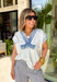 Casual, comfy, and just a little elevated! This textured white short sleeve hoodie features soft washed blue detailing along the front, sleeves, and trim for a laid-back, lived-in look. It’s the perfect mix of cozy and lightweight, making it easy to wear year-round. Designed with front pockets for added functionality and a relaxed silhouette, this hoodie is ideal for running errands, lounging, or throwing on for an easy everyday outfit. 