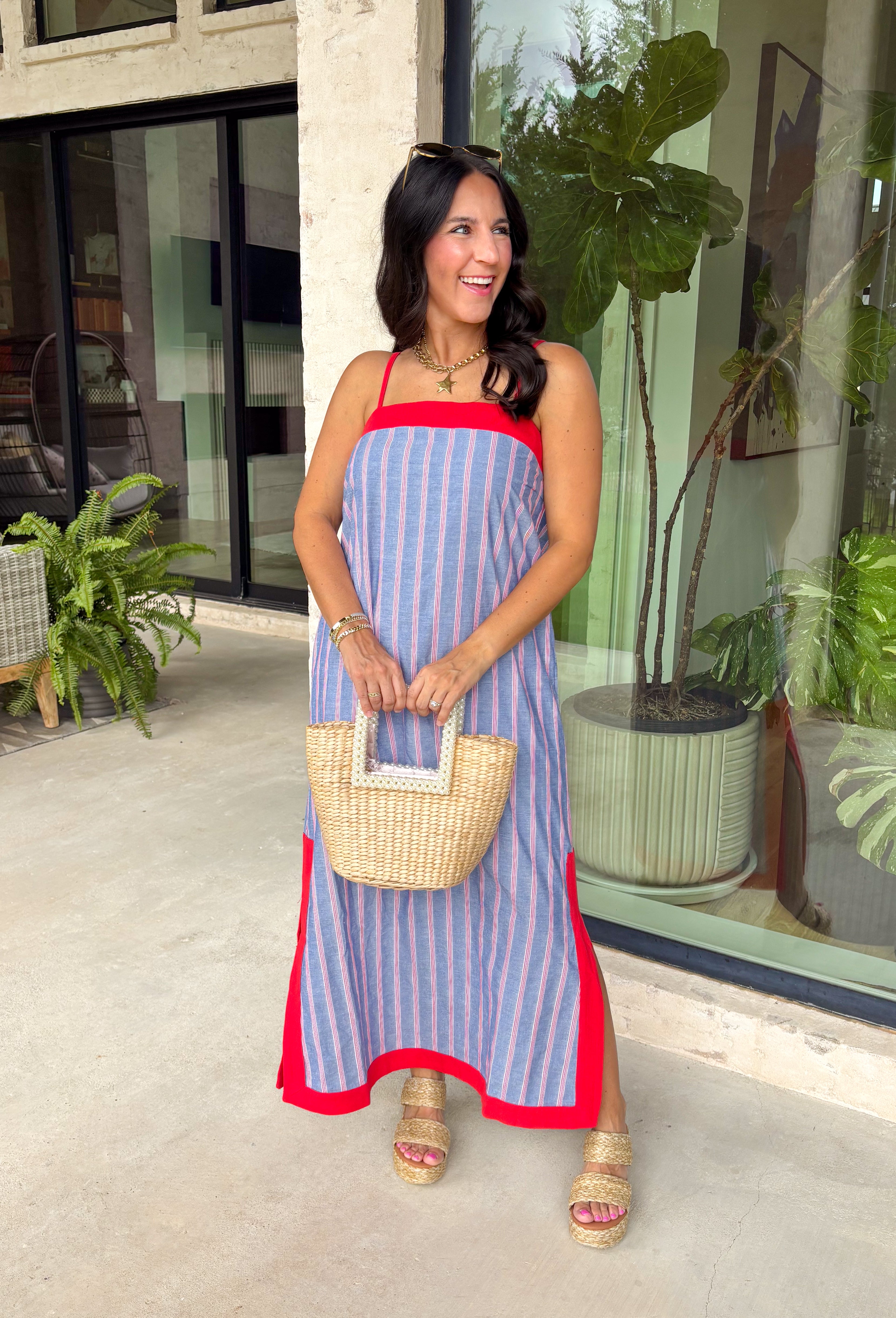 This chambray midi dress is made for all your 4th of July celebrations! From backyard BBQs and parades to fireworks under the stars, this dress is the perfect patriotic pick. The red and white stripe print pops against the chambray blue background, while the bold red contrast trim adds a fun, festive touch. Adjustable straps and a smocked back create a comfortable, flattering fit, and the side slits add easy movement for warm summer days. Fully lined and finished with side pockets.