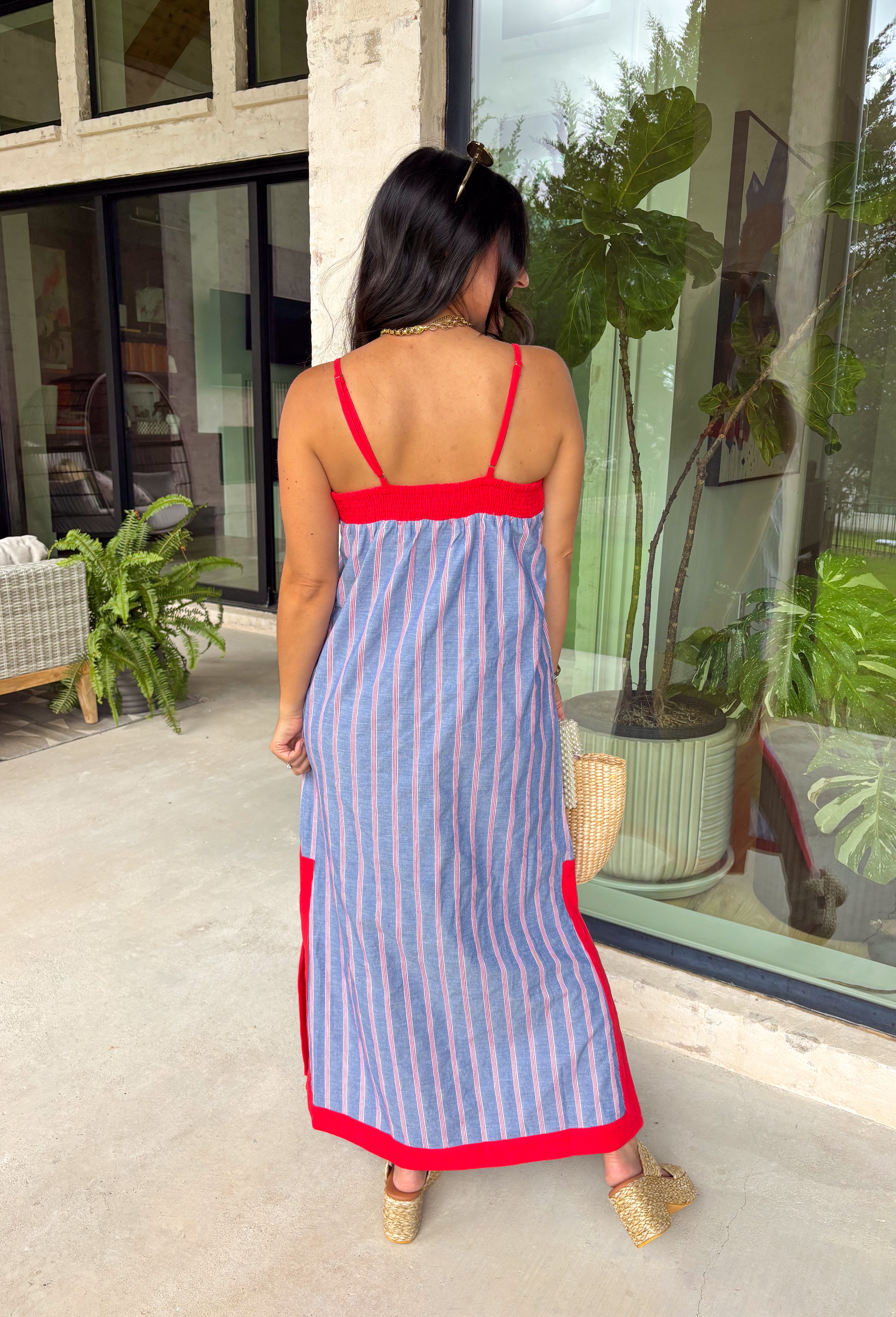 This chambray midi dress is made for all your 4th of July celebrations! From backyard BBQs and parades to fireworks under the stars, this dress is the perfect patriotic pick. The red and white stripe print pops against the chambray blue background, while the bold red contrast trim adds a fun, festive touch. Adjustable straps and a smocked back create a comfortable, flattering fit, and the side slits add easy movement for warm summer days. Fully lined and finished with side pockets.