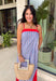 This chambray midi dress is made for all your 4th of July celebrations! From backyard BBQs and parades to fireworks under the stars, this dress is the perfect patriotic pick. The red and white stripe print pops against the chambray blue background, while the bold red contrast trim adds a fun, festive touch. Adjustable straps and a smocked back create a comfortable, flattering fit, and the side slits add easy movement for warm summer days. Fully lined and finished with side pockets.