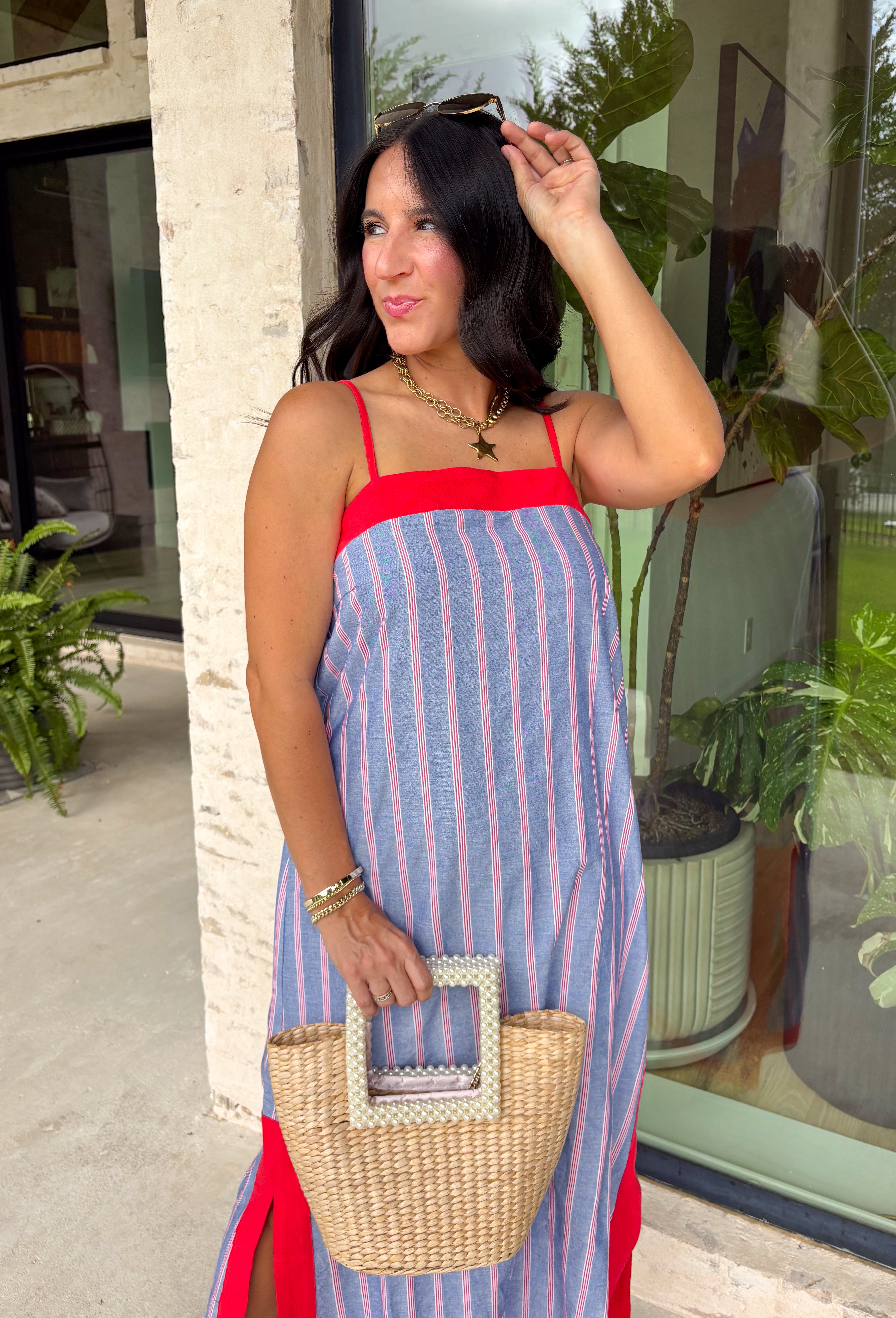 This chambray midi dress is made for all your 4th of July celebrations! From backyard BBQs and parades to fireworks under the stars, this dress is the perfect patriotic pick. The red and white stripe print pops against the chambray blue background, while the bold red contrast trim adds a fun, festive touch. Adjustable straps and a smocked back create a comfortable, flattering fit, and the side slits add easy movement for warm summer days. Fully lined and finished with side pockets.