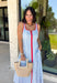 Classic stripes with a pop of color? Yes please! This blue and white striped sleeveless midi dress by Entro is the perfect spring-to-summer piece when you want something easy, flattering, and a little fun. The red contrast trim adds the cutest standout detail, and the v-cut neckline gives it a clean, modern touch that feels effortlessly polished. Just add sandals and sunnies for daytime, or dress it up with wedges and gold jewelry for an easy night-out look.