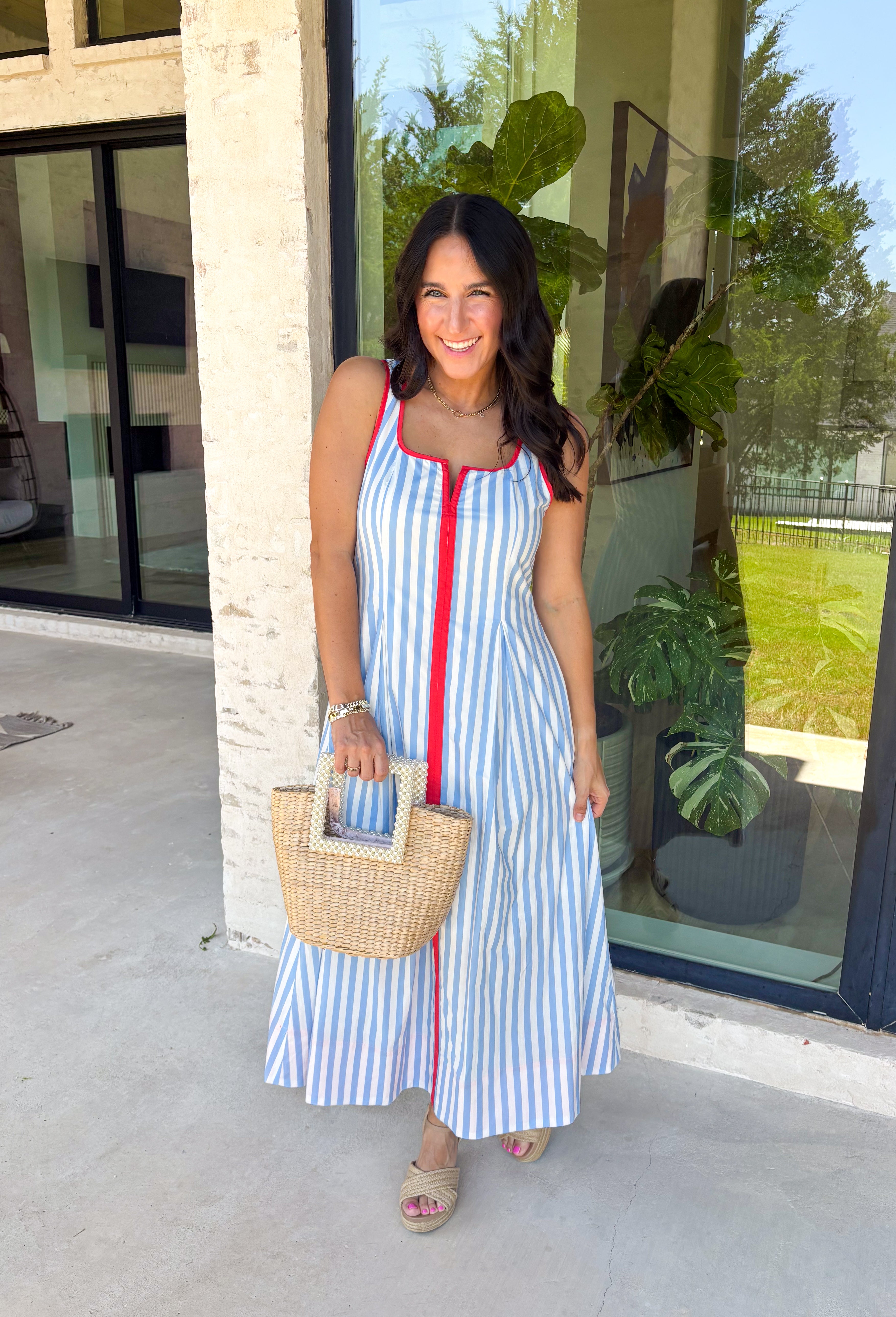 Classic stripes with a pop of color? Yes please! This blue and white striped sleeveless midi dress by Entro is the perfect spring-to-summer piece when you want something easy, flattering, and a little fun. The red contrast trim adds the cutest standout detail, and the v-cut neckline gives it a clean, modern touch that feels effortlessly polished. Just add sandals and sunnies for daytime, or dress it up with wedges and gold jewelry for an easy night-out look.