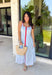 Classic stripes with a pop of color? Yes please! This blue and white striped sleeveless midi dress by Entro is the perfect spring-to-summer piece when you want something easy, flattering, and a little fun. The red contrast trim adds the cutest standout detail, and the v-cut neckline gives it a clean, modern touch that feels effortlessly polished. Just add sandals and sunnies for daytime, or dress it up with wedges and gold jewelry for an easy night-out look.