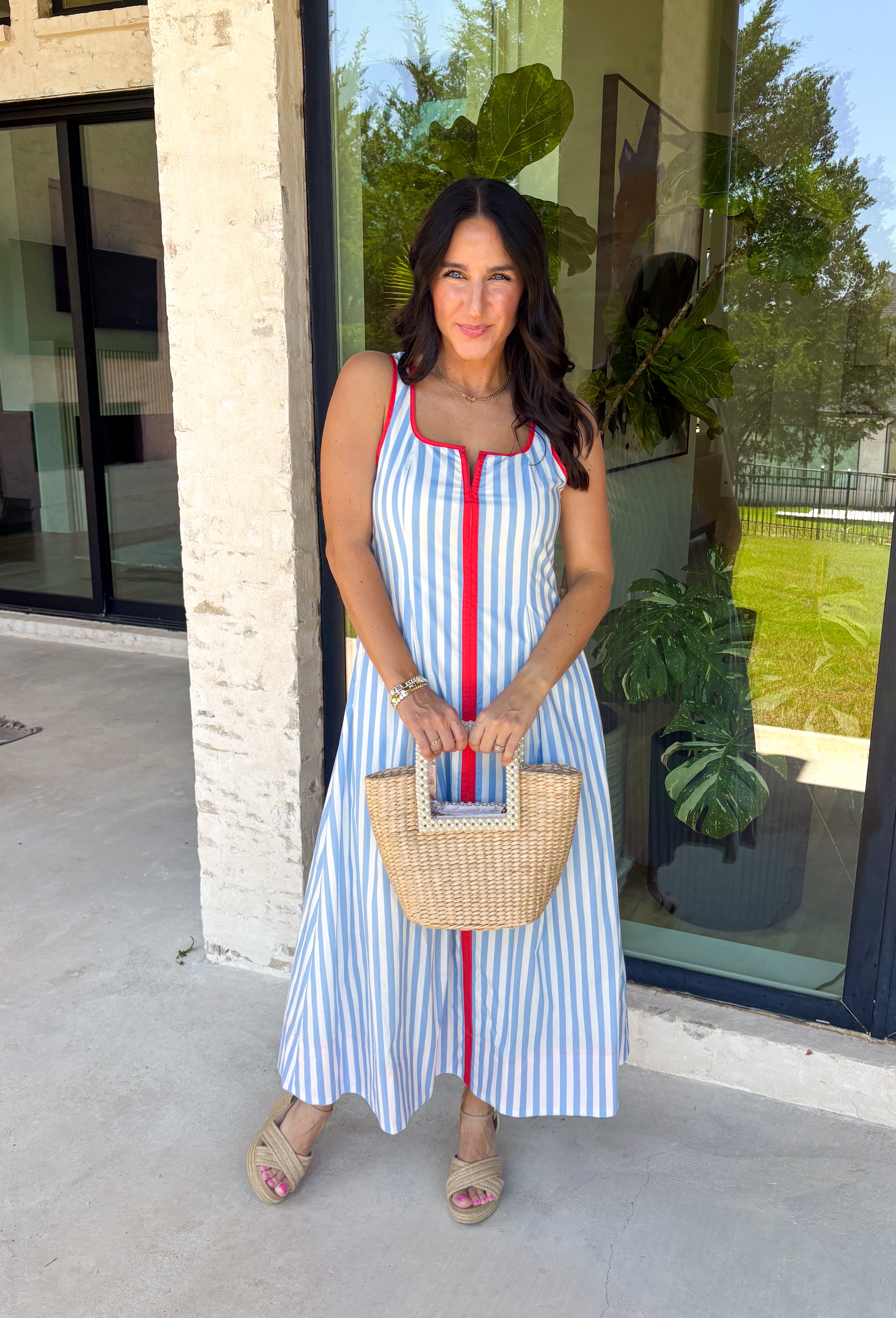 Classic stripes with a pop of color? Yes please! This blue and white striped sleeveless midi dress by Entro is the perfect spring-to-summer piece when you want something easy, flattering, and a little fun. The red contrast trim adds the cutest standout detail, and the v-cut neckline gives it a clean, modern touch that feels effortlessly polished. Just add sandals and sunnies for daytime, or dress it up with wedges and gold jewelry for an easy night-out look.