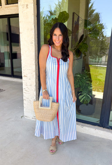Classic stripes with a pop of color? Yes please! This blue and white striped sleeveless midi dress by Entro is the perfect spring-to-summer piece when you want something easy, flattering, and a little fun. The red contrast trim adds the cutest standout detail, and the v-cut neckline gives it a clean, modern touch that feels effortlessly polished. Just add sandals and sunnies for daytime, or dress it up with wedges and gold jewelry for an easy night-out look.
