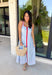 Classic stripes with a pop of color? Yes please! This blue and white striped sleeveless midi dress by Entro is the perfect spring-to-summer piece when you want something easy, flattering, and a little fun. The red contrast trim adds the cutest standout detail, and the v-cut neckline gives it a clean, modern touch that feels effortlessly polished. Just add sandals and sunnies for daytime, or dress it up with wedges and gold jewelry for an easy night-out look.