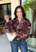 Make your fall layers a little more interesting with this deep burgundy jacket from Entro. A unique mix of stripes and neutral floral prints brings together rich autumn shades for a look that stands out while still being easy to style. The collared neckline and zipper-front closure give it a classic jacket feel, while the bubble hem adds shape and a fun, modern finish. Made from 100% cotton, it’s a great lightweight layer for those in-between fall days when you need just a little something extra. 