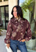 Make your fall layers a little more interesting with this deep burgundy jacket from Entro. A unique mix of stripes and neutral floral prints brings together rich autumn shades for a look that stands out while still being easy to style. The collared neckline and zipper-front closure give it a classic jacket feel, while the bubble hem adds shape and a fun, modern finish. Made from 100% cotton, it’s a great lightweight layer for those in-between fall days when you need just a little something extra. 