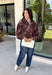 Make your fall layers a little more interesting with this deep burgundy jacket from Entro. A unique mix of stripes and neutral floral prints brings together rich autumn shades for a look that stands out while still being easy to style. The collared neckline and zipper-front closure give it a classic jacket feel, while the bubble hem adds shape and a fun, modern finish. Made from 100% cotton, it’s a great lightweight layer for those in-between fall days when you need just a little something extra. 
